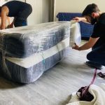 CarePhilly Movers Employees wrapping a mattress